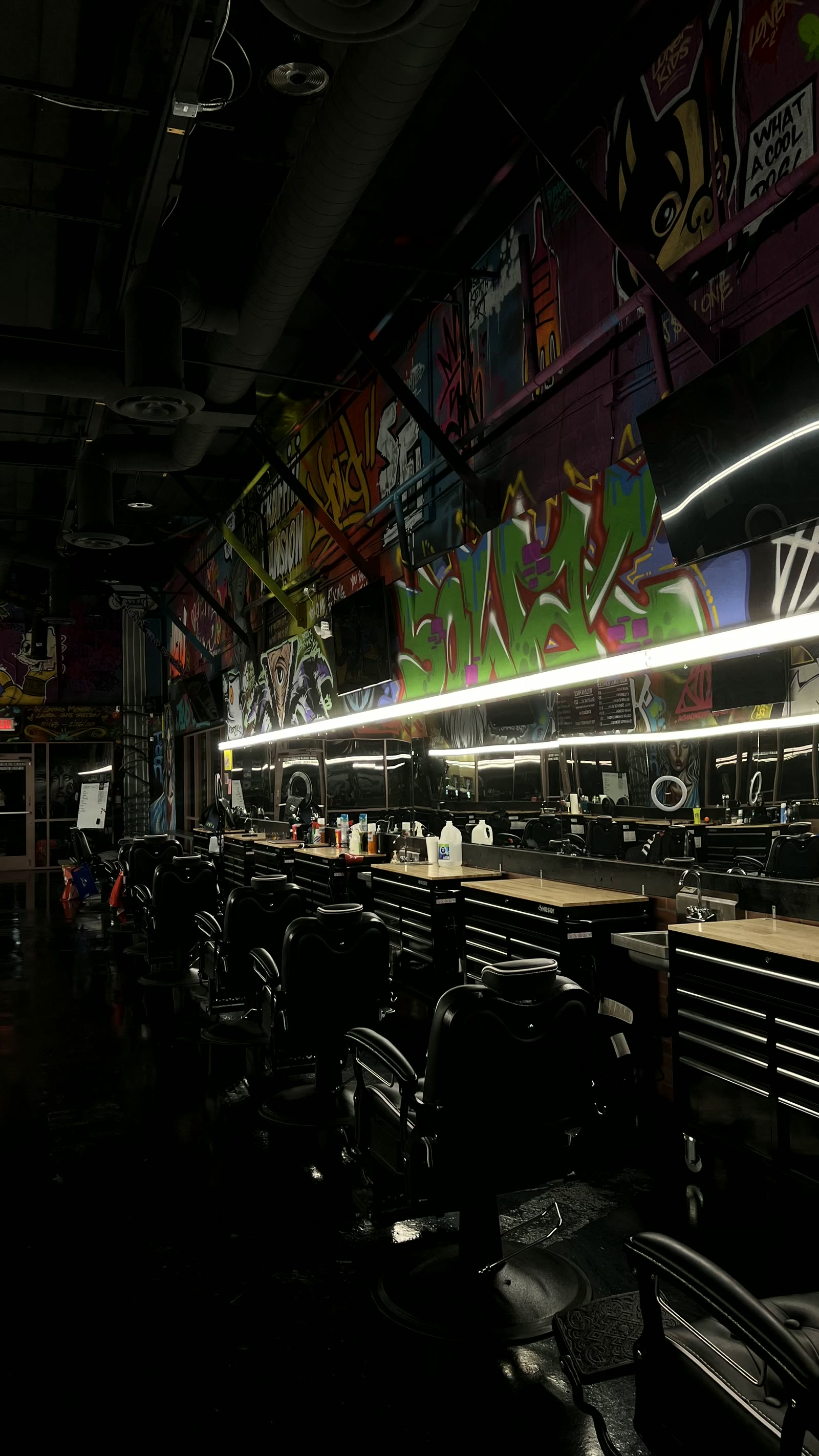 Inside the shop: graffiti walls and barber chairs